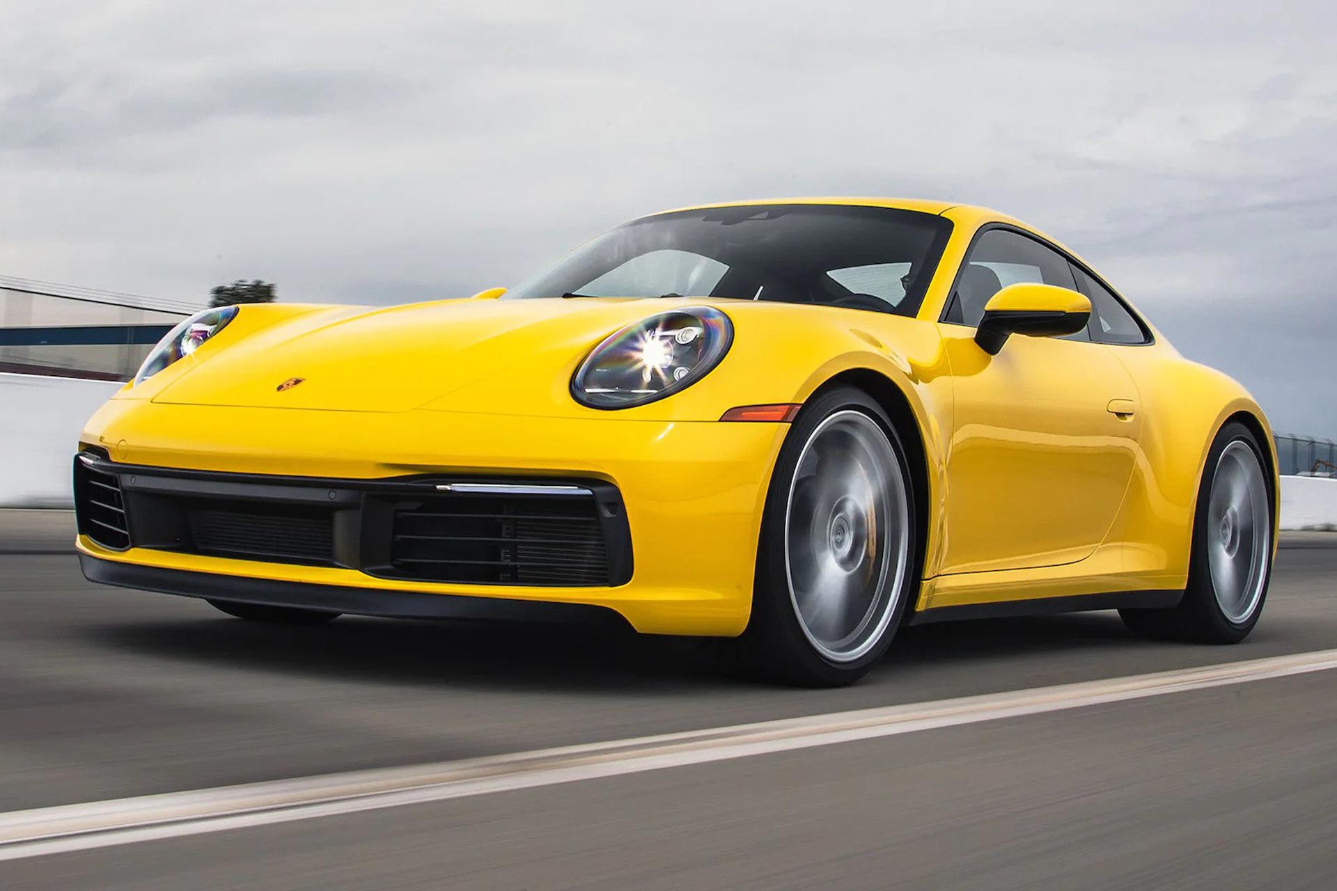 porsche 911 carrera driving on race track